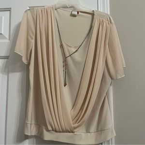 Brand new fancy top, with a necklace, slimming fashionable sleeves, flattering.